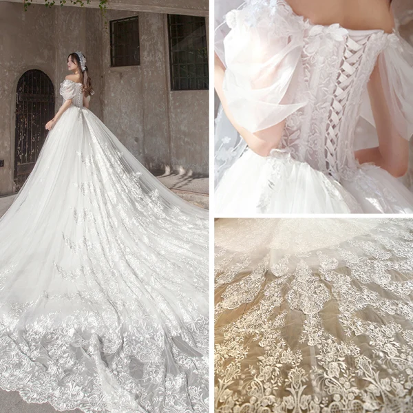 Étourdissant Ivoire Robe De Mariée 2019 Princesse De l'épaule Gonflée Manches Courtes Dos Nu Appliques En Dentelle Tulle Glitter Royal Train Volants