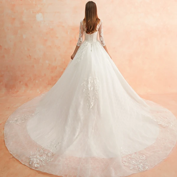 Meilleur Ivoire Transparentes Robe De Mariée 2019 Princesse Encolure Dégagée 3/4 Manches Dos Nu Appliques En Dentelle Perlage Cathedral Train Volants