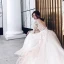 Illusion Champagner Durchsichtige Brautkleider / Hochzeitskleider 2019 A Linie Tiefer V-Ausschnitt Lange Ärmel Applikationen Spitze Perlenstickerei Kathedrale Schleppe Rüschen