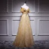 Chic / Beautiful Gold Evening Dresses  2018 A-Line / Princess Spaghetti Straps Short Sleeve Appliques Sequins Floor-Length / Long Ruffle Backless Formal Dresses