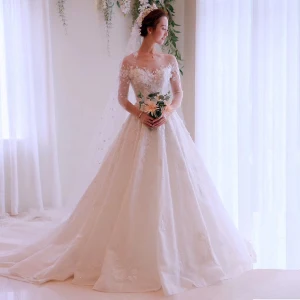 Glamour Ivoire Transparentes Robe De Mariée 2019 Princesse Encolure Dégagée 3 4 Manches Dos Nu Appliques En Dentelle Chapel Train Volants