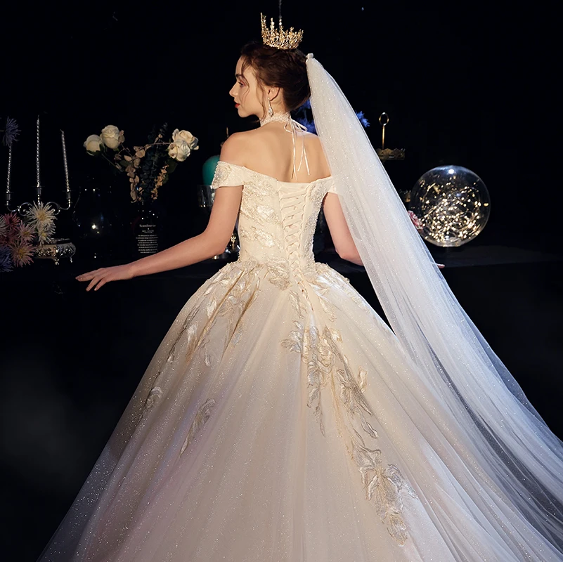 Bling Bling Champagne Wedding Dresses 2019 A Line Princess Off The Shoulder  Short Sleeve Backless Appliques Lace Glitter Tulle Cathedral Train Ruffle