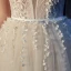 Meilleur Champagne Jardin / Extérieur Robe De Mariée 2019 Princesse Bretelles Spaghetti Transparentes Col v profond Sans Manches Dos Nu Appliques En Dentelle Perlage Perle Glitter Tulle Train De Balayage Volants