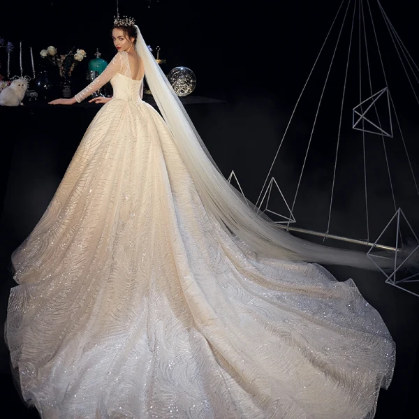 Bling Bling Champagner Durchsichtige Brautkleider / Hochzeitskleider 2019 A Linie Rundhalsausschnitt Lange Ärmel Rückenfreies Perlenstickerei Perle Glanz Pailletten Kathedrale Schleppe Rüschen