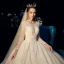 Bling Bling Champagner Durchsichtige Brautkleider / Hochzeitskleider 2019 A Linie Rundhalsausschnitt Lange Ärmel Rückenfreies Perlenstickerei Perle Glanz Pailletten Kathedrale Schleppe Rüschen