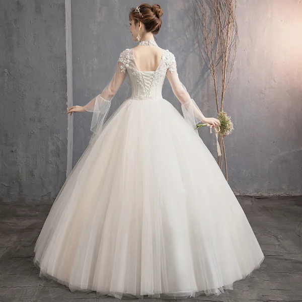 Affordable Champagne See-through Outdoor / Garden Wedding Dresses 2019 Ball Gown High Neck Bell sleeves Backless Appliques Lace Pearl Beading Floor-Length / Long Ruffle