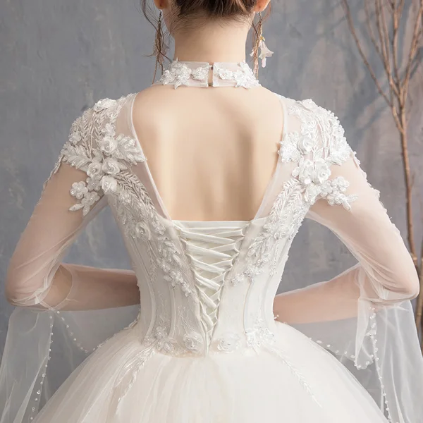 Affordable Champagne See-through Outdoor / Garden Wedding Dresses 2019 Ball Gown High Neck Bell sleeves Backless Appliques Lace Pearl Beading Floor-Length / Long Ruffle