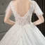 Illusion Ivoire Robe De Mariée 2019 Princesse V-Cou Manches Courtes Dos Nu Appliques En Dentelle Perlage Chapel Train Volants