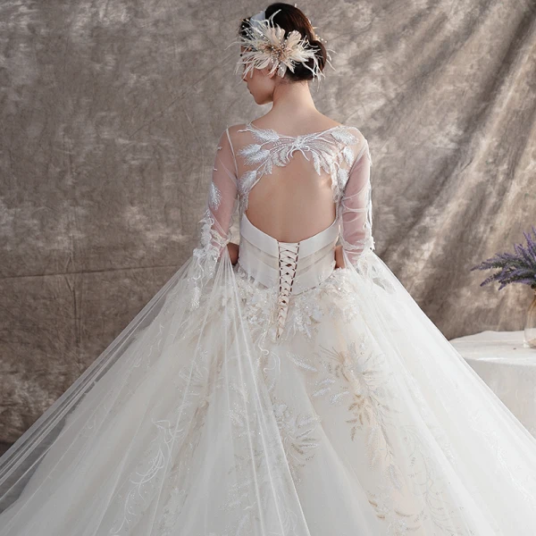 Illusion Champagne See-through Wedding Dresses 2019 Ball Gown Scoop Neck Backless Bell sleeves Beading Appliques Lace Watteau Train Ruffle