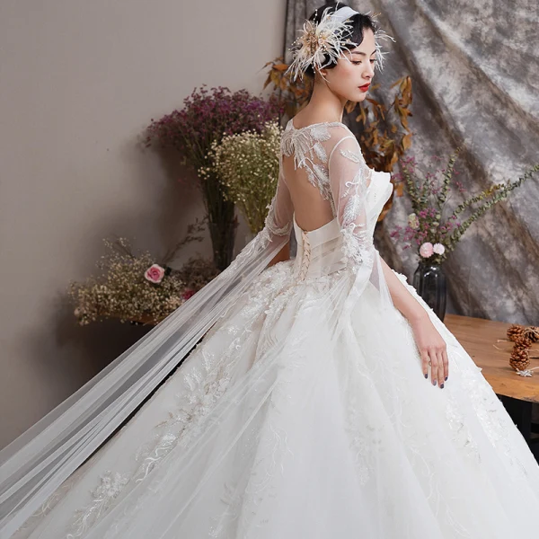 Illusion Champagne See-through Wedding Dresses 2019 Ball Gown Scoop Neck Backless Bell sleeves Beading Appliques Lace Watteau Train Ruffle