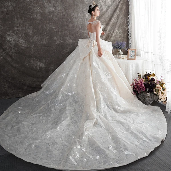 Luxe Champagne Transparentes Robe De Mariée 2019 Robe Boule Encolure Carrée Sans Manches Dos Nu Perlage Glitter Tulle Cathedral Train Volants