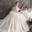 Luxe Champagne Transparentes Robe De Mariée 2019 Robe Boule Encolure Carrée Sans Manches Dos Nu Perlage Glitter Tulle Cathedral Train Volants