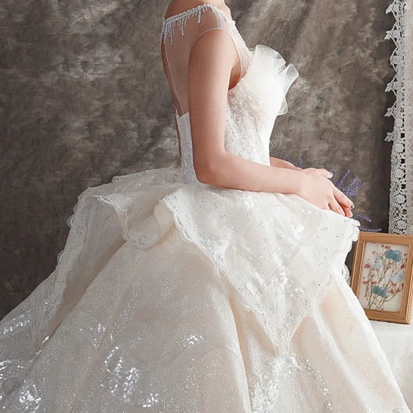 Luxe Champagne Transparentes Robe De Mariée 2019 Robe Boule Encolure Carrée Sans Manches Dos Nu Perlage Glitter Tulle Cathedral Train Volants