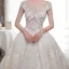Illusion Champagne Transparentes Robe De Mariée 2019 Princesse Encolure Dégagée Mancherons Dos Nu Appliques En Dentelle Faux Diamant Perlage Glitter Tulle Cathedral Train Volants