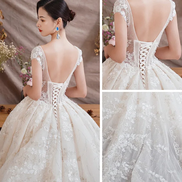 Illusion Champagne Transparentes Robe De Mariée 2019 Princesse Encolure Dégagée Mancherons Dos Nu Appliques En Dentelle Faux Diamant Perlage Glitter Tulle Cathedral Train Volants