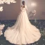 Elegante Champagner Durchsichtige Brautkleider / Hochzeitskleider 2019 A Linie Rundhalsausschnitt Kurze Ärmel Rückenfreies Schleife Applikationen Spitze Kapelle-Schleppe Rüschen