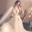 Elegante Champagner Durchsichtige Brautkleider / Hochzeitskleider 2019 A Linie Rundhalsausschnitt Kurze Ärmel Rückenfreies Schleife Applikationen Spitze Kapelle-Schleppe Rüschen
