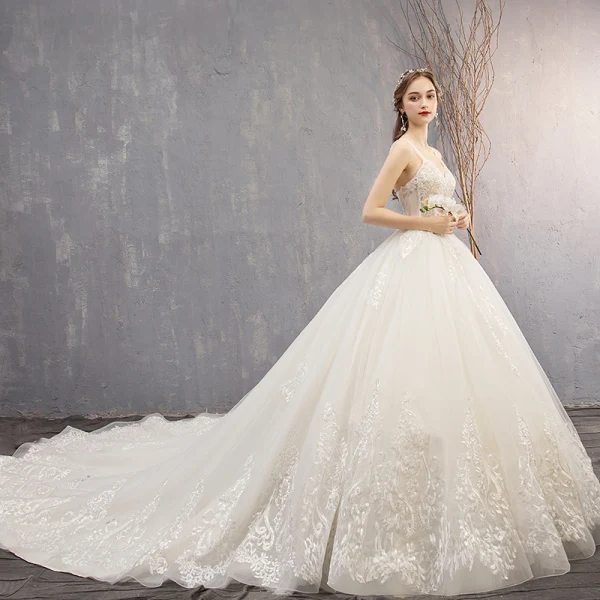 Best Ivory Wedding Dresses 2019 Ball Gown Spaghetti Straps Sleeveless Backless Appliques Lace Beading Chapel Train Ruffle