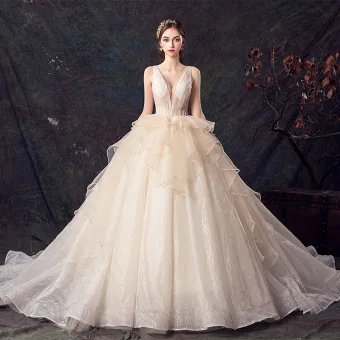Chic Belle Champagne Robe De Mariée 2019 Robe Boule Transparentes Col V Profond Sans Manches Dos Nu Glitter Tulle Chapel Train Volants