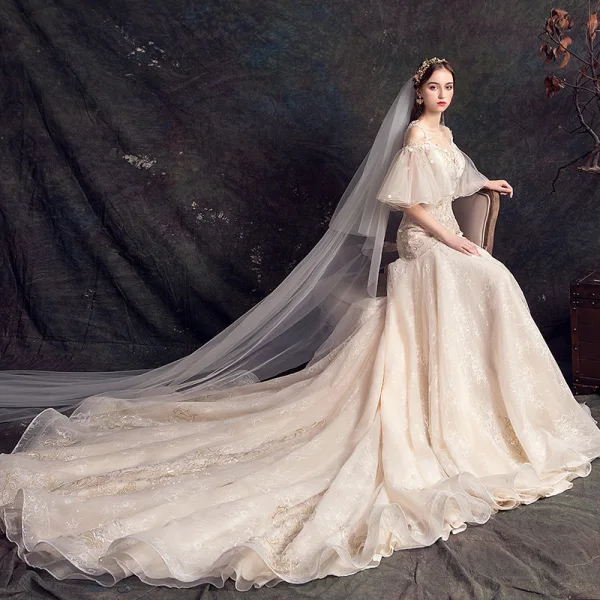 Elegante Champagner Durchsichtige Brautkleider / Hochzeitskleider 2019 Meerjungfrau Eckiger Ausschnitt Glockenhülsen Rückenfreies Applikationen Spitze Blumen Perle Pailletten Perlenstickerei Hof-Schleppe Rüschen