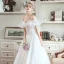 Élégant Ivoire Jardin / Extérieur Robe De Mariée 2019 Princesse De l'épaule Gonflée Manches Courtes Dos Nu Appliques En Dentelle Train De Balayage Volants