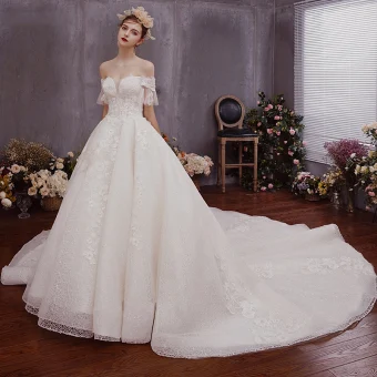 Chic Beautiful Champagne Lace Wedding Dresses 2019 A Line Princess Off The Shoulder Bell Sleeves Backless Bow Appliques Lace Beading Chapel Train