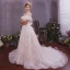 Élégant Champagne Robe De Mariée 2019 Princesse Transparentes Encolure Dégagée Manches Courtes Dos Nu Appliques En Dentelle Plumes Glitter Tulle Tribunal Train Volants