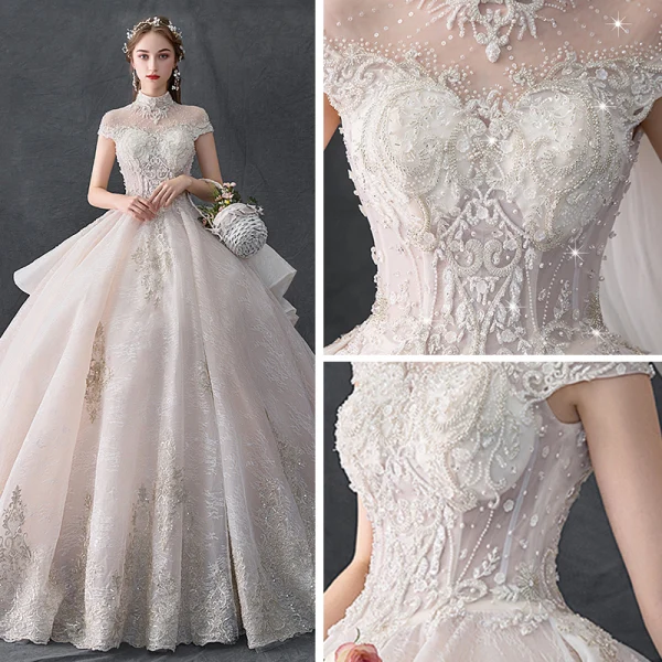 Luxury / Gorgeous Vintage / Retro Champagne See-through Wedding Dresses 2019 Ball Gown High Neck Cap Sleeves Backless Appliques Lace Handmade  Beading Cathedral Train Ruffle