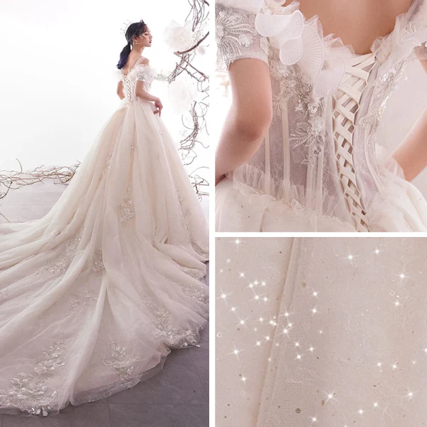 Schöne Champagner Brautkleider / Hochzeitskleider 2019 A Linie Off Shoulder Kurze Ärmel Rückenfreies Applikationen Spitze Perlenstickerei Pailletten Glanz Tülle Kathedrale Schleppe Rüschen