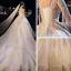 Luxe Champagne Transparentes Robe De Mariée 2019 Princesse Col v profond Manches Courtes Perlage Gland Dos Nu Appliques En Dentelle Cathedral Train Volants