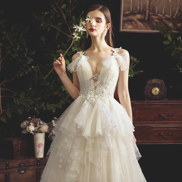 Chic / Beautiful Champagne Wedding Dresses 2019 A-Line / Princess See-through Deep V-Neck Sleeveless Backless Appliques Lace Beading Court Train Ruffle