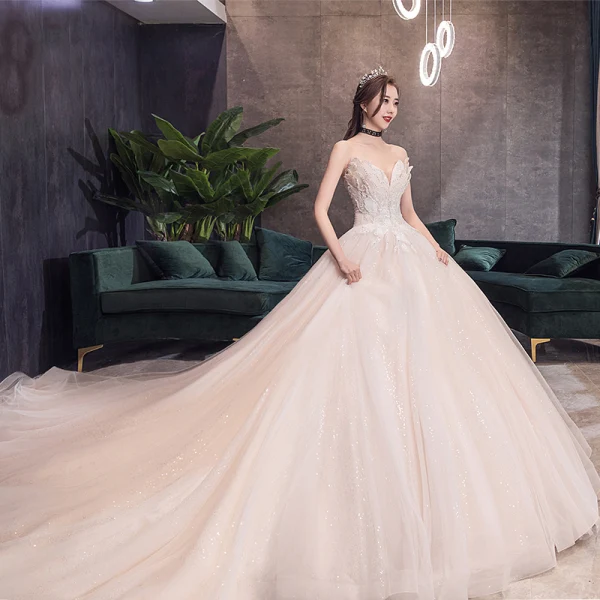 Sjarmerende Champagne Korsett Brudekjoler 2019 Prinsesse Kjæreste Uten Ermer Ryggløse Appliques Blonder Beading Glitter Tyll Cathedral Train