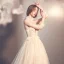 Elegant Champagne See-through Outdoor / Garden Wedding Dresses 2019 A-Line / Princess High Neck 3/4 Sleeve Appliques Lace Beading Glitter Tulle Court Train Ruffle