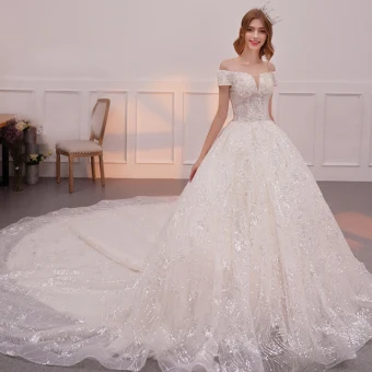 Bling Bling Champagne Wedding Dresses 2019 A Line Princess Off The Shoulder Short Sleeve Backless Appliques Lace Glitter Sequins Cathedral Train Ruffle