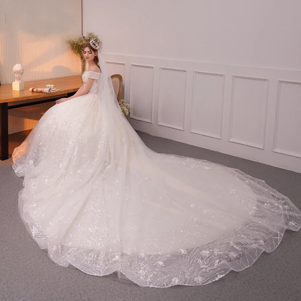 Bling Bling Champagne Robe De Mariée 2019 Princesse De l'épaule Manches Courtes Dos Nu Appliques En Dentelle Glitter Paillettes Cathedral Train Volants