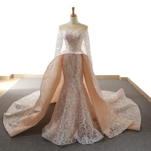 Étourdissant Champagne Transparentes Robe De Mariée 2019 Trompette Sirène Encolure Dégagée Manches Longues Dos Nu Glitter Appliques En Dentelle Chapel Train Volants
