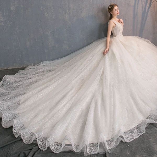 Edles Champagner Spitze Brautkleider / Hochzeitskleider 2019 A Linie Tiefer V-Ausschnitt Ärmellos Rückenfreies Perlenstickerei Perle Pailletten Glanz Kapelle-Schleppe Rüschen