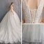 Edles Champagner Spitze Brautkleider / Hochzeitskleider 2019 A Linie Tiefer V-Ausschnitt Ärmellos Rückenfreies Perlenstickerei Perle Pailletten Glanz Kapelle-Schleppe Rüschen