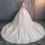 Schöne Champagner Durchsichtige Brautkleider / Hochzeitskleider 2019 A Linie Rundhalsausschnitt Kurze Ärmel Perlenstickerei Quaste Rückenfreies Applikationen Spitze Kapelle-Schleppe Rüschen