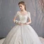 Schöne Champagner Durchsichtige Brautkleider / Hochzeitskleider 2019 A Linie Rundhalsausschnitt Kurze Ärmel Perlenstickerei Quaste Rückenfreies Applikationen Spitze Kapelle-Schleppe Rüschen