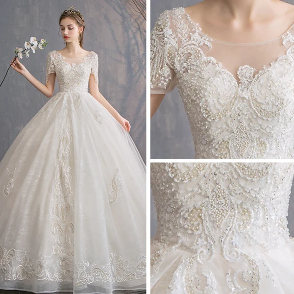Schöne Champagner Durchsichtige Brautkleider / Hochzeitskleider 2019 A Linie Rundhalsausschnitt Kurze Ärmel Perlenstickerei Quaste Rückenfreies Applikationen Spitze Kapelle-Schleppe Rüschen