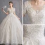 Schöne Champagner Durchsichtige Brautkleider / Hochzeitskleider 2019 A Linie Rundhalsausschnitt Kurze Ärmel Perlenstickerei Quaste Rückenfreies Applikationen Spitze Kapelle-Schleppe Rüschen