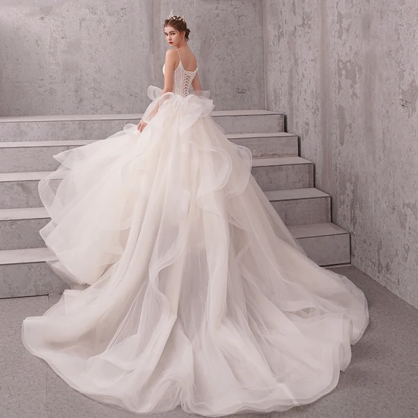 Schöne Ivory / Creme Brautkleider / Hochzeitskleider 2019 A Linie Perlenstickerei Perle Spaghettiträger Ärmellos Rückenfreies Applikationen Spitze Kapelle-Schleppe Rüschen