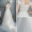 Abordable Champagne Jardin / Extérieur Robe De Mariée 2019 Princesse De l'épaule Manches Courtes Dos Nu Appliques En Dentelle Perlage Perle Train De Balayage Volants
