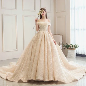 Bling Bling Champagne Wedding Dresses 2019 A Line Princess Off The Shoulder Short Sleeve Backless Sequins Beading Glitter Tulle Cathedral Train Ruffle