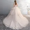Chic / Beautiful Champagne See-through Wedding Dresses 2018 Ball Gown Scoop Neck Cap Sleeves Backless Appliques Flower Sequins Pearl Ruffle Cathedral Train