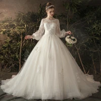 Elegante Ivoor Doorzichtige Trouwjurken 2019 Prinses Ronde Hals Gezwollen Lange Mouwen Ruglooze Appliques Kant Chapel Train Ruche