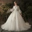 Elegante Ivory / Creme Durchsichtige Brautkleider / Hochzeitskleider 2019 Prinzessin Rundhalsausschnitt Geschwollenes Lange Ärmel Rückenfreies Applikationen Spitze Kapelle-Schleppe Rüschen