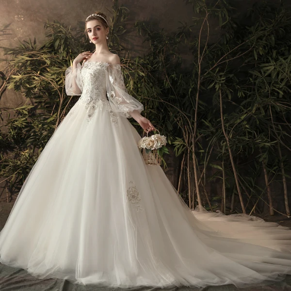Élégant Ivoire Transparentes Robe De Mariée 2019 Princesse De l'épaule Gonflée Manches Longues Dos Nu Appliques En Dentelle Fleur Perle Chapel Train Volants