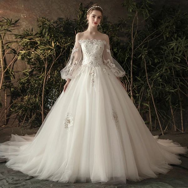 Élégant Ivoire Transparentes Robe De Mariée 2019 Princesse De l'épaule Gonflée Manches Longues Dos Nu Appliques En Dentelle Fleur Perle Chapel Train Volants